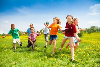 Children running in the meadow