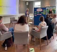 
		Several participants are sitting in a seminar room
	