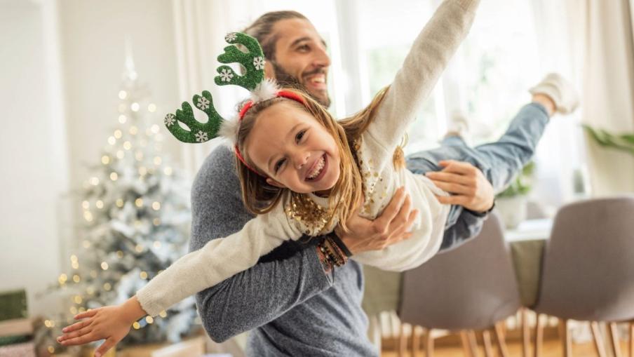 
		Young father with daughter at Christmas
	