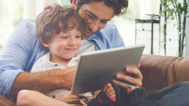 
		Father and son with a tablet
	