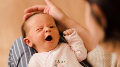 
		Mother with yawning baby
	