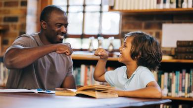 
		Teachers and pupils give high-fives
	