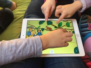 
		Child with tablet
	