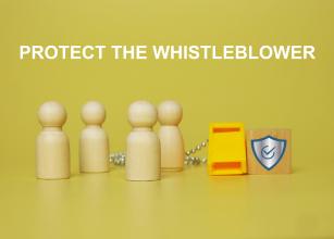 
		Play figures and inscription Protect the Whistleblower
	