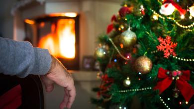 
		Lonely man in front of Christmas tree
	