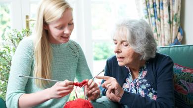 
		Young woman with grandma knitting
	