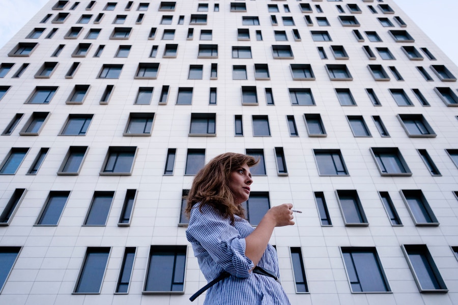 Lonely employees in front of office building