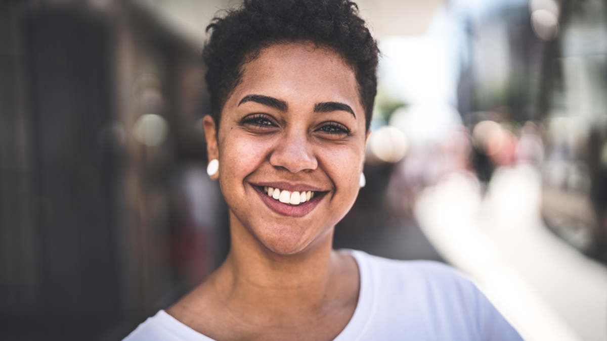 short-haired woman smiles