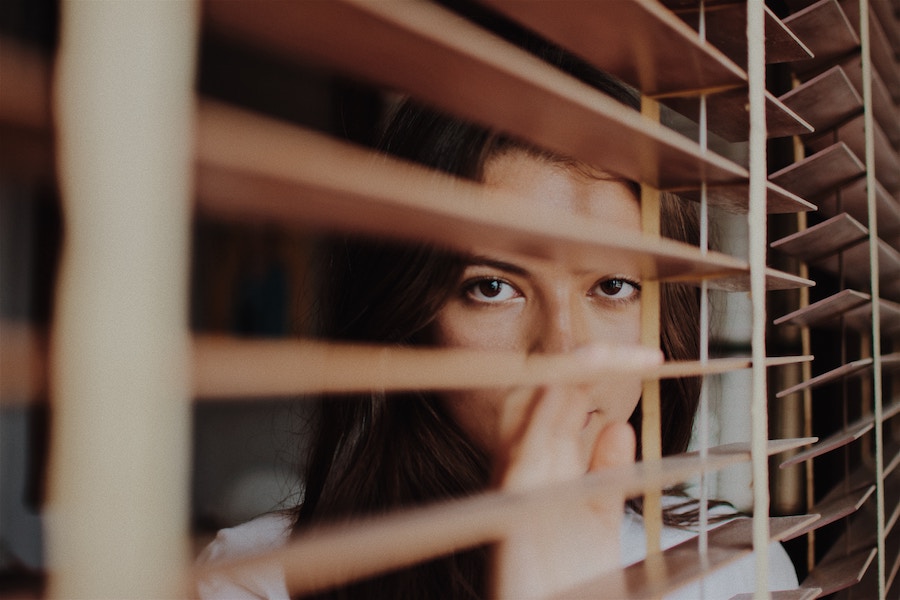 Young woman looks anxious