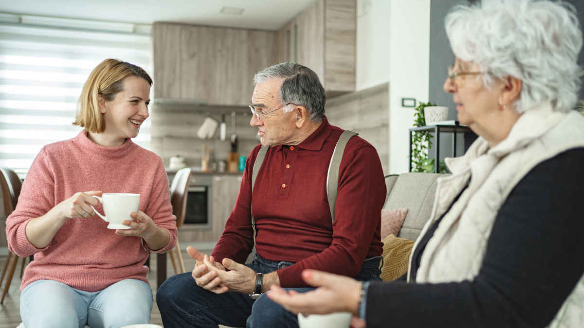Senior citizens in conversation with daughter