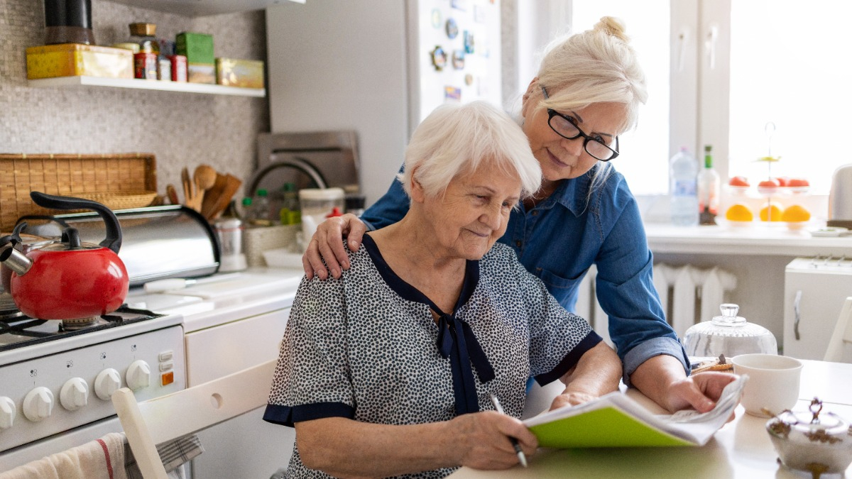 Woman takes care of elderly lady