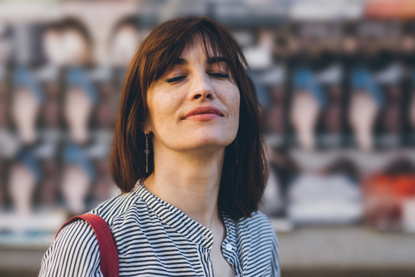 Woman looks relaxed into the camera