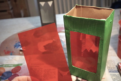 Making a lantern for St. Martin's Day - gluing in foil