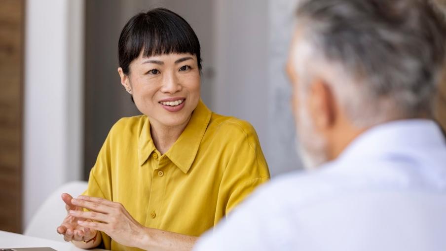 
		A consultation between a woman and a man in an office
	