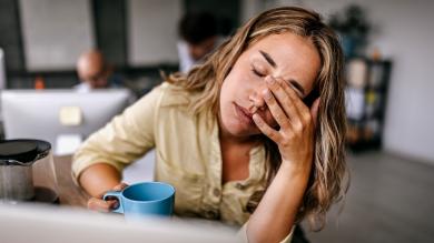 
		Woman is sick and tired in the office
	