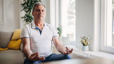 
		A man breathes calmly at home to get his panic under control
	