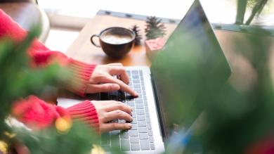 
		Close-up of female reading hands typing on a laptop keyboard
	