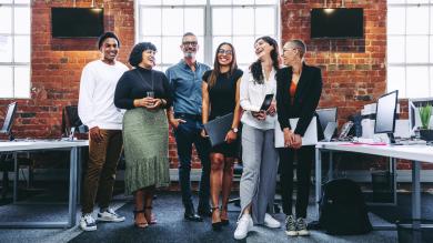 
		A team consisting of different generations has fun in the office
	