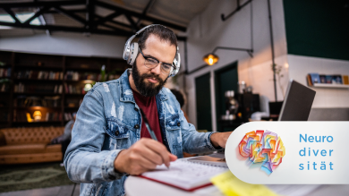 
		A man wearing headphones is sitting at his laptop
	