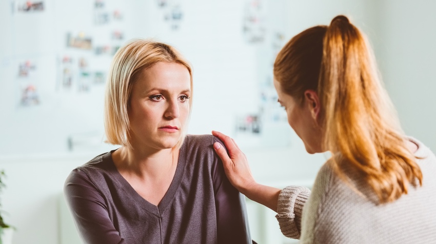 Woman who experiences violence at home in a counseling interview