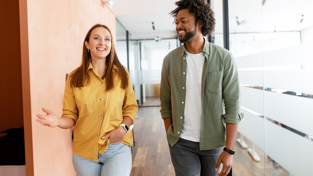 Two team members in conversation