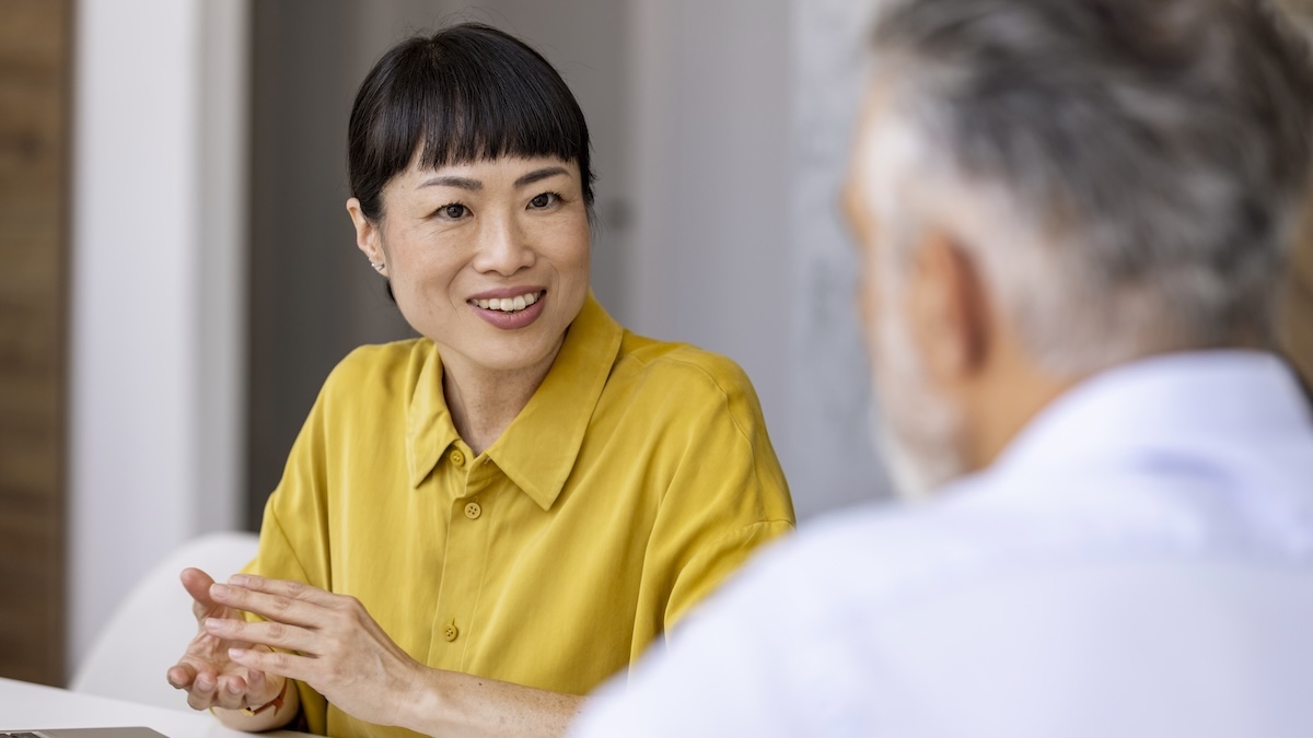 A consultation between a woman and a man in an office