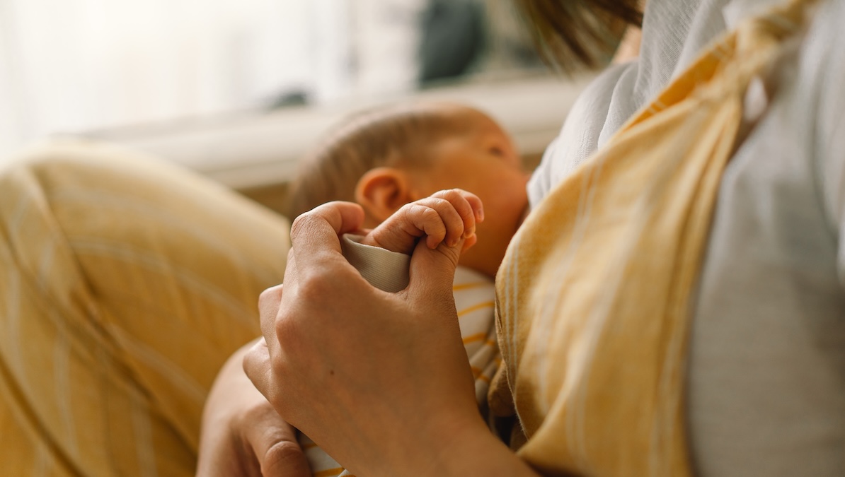 Mother breastfeeding her newborn baby