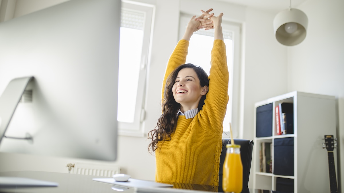 Woman stretching at her desk