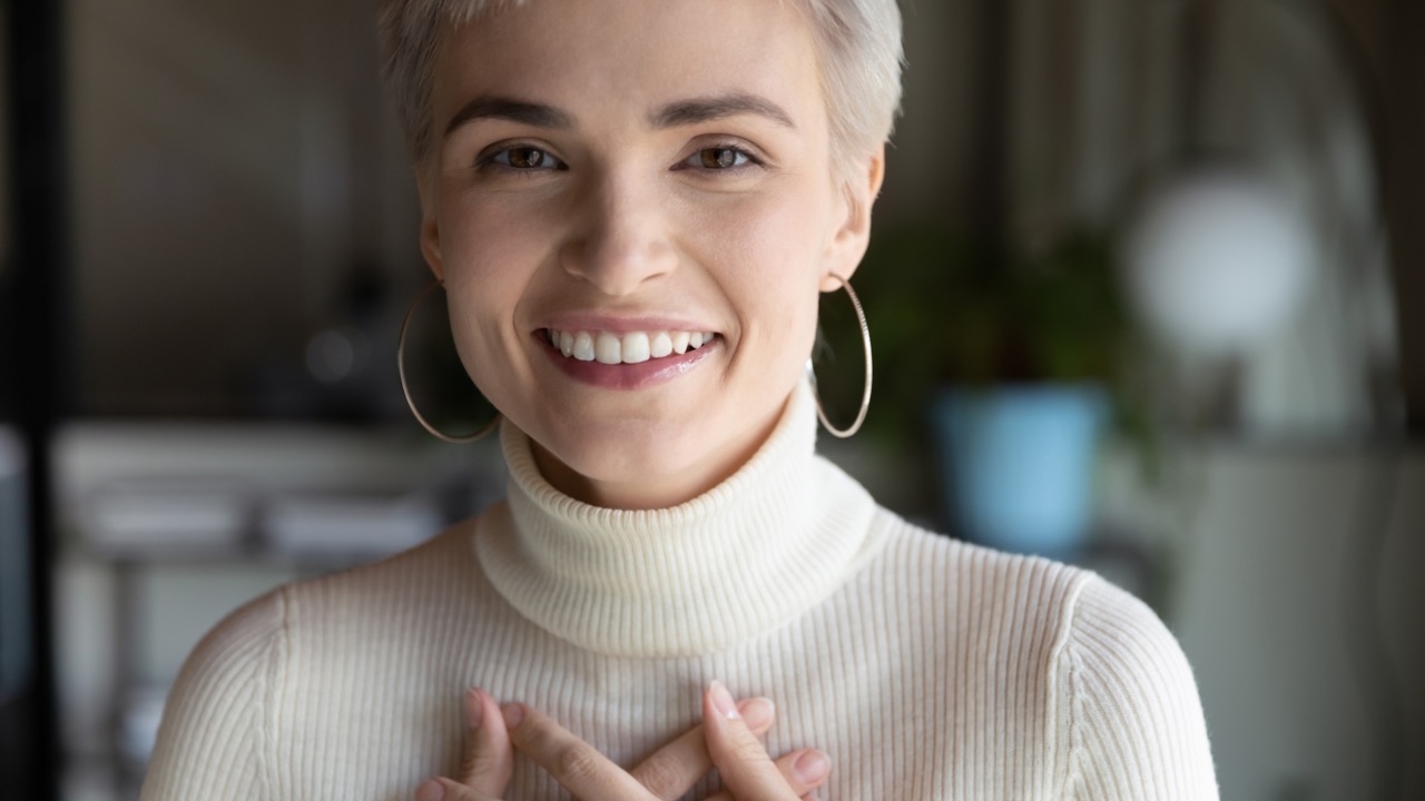 Woman smiles gratefully