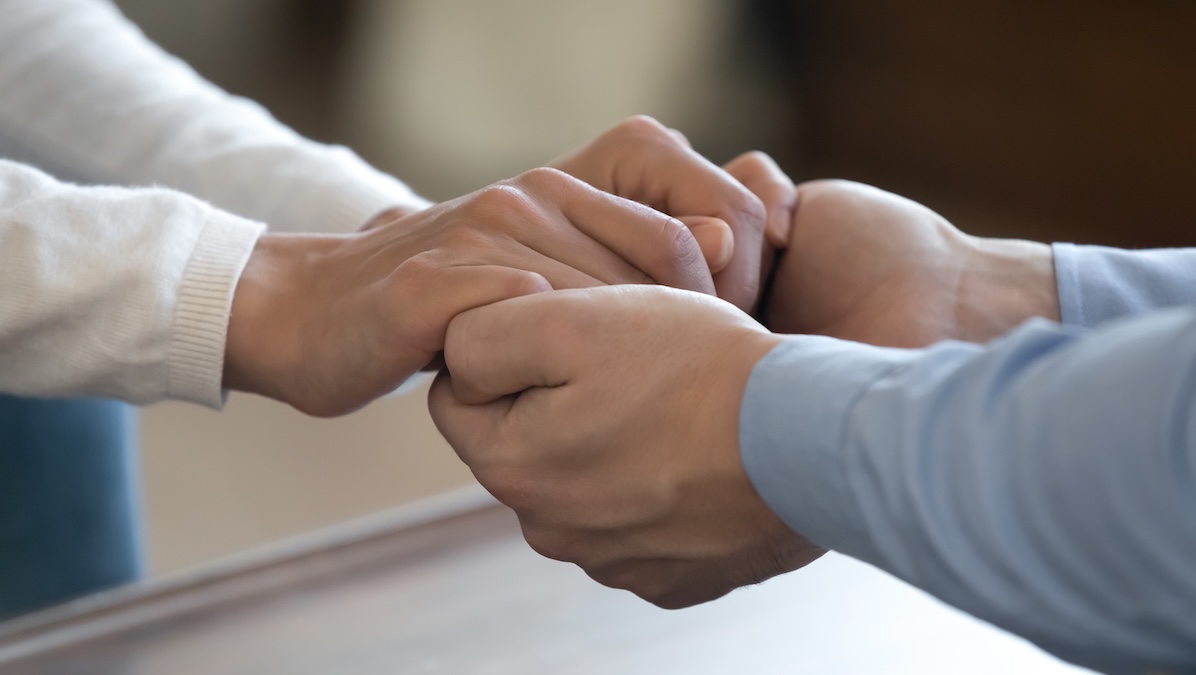 Two holding hands