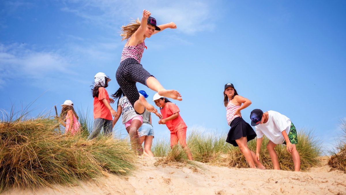 Children have fun on the beach